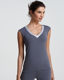 A sleeveless pajama top with a contrast silk trimmed neckline from Calvin Klein.