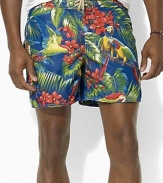 A classic-fitting swim trunk is designed in super-soft, quick-dry microfiber with a tropical parrot print for the ultimate beach-ready style.