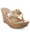 Make them look in G by Guess' Preview platform wedge sandals. A shiny upper sets the foundation for the sparkly logo on the straps.