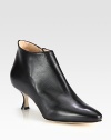 Sculpted silhouette of rich Italian leather heightened by a petite, self-covered heel. Self-covered heel, 2½ (65mm)Leather upperSide zipLeather lining and solePadded insoleMade in Italy