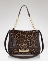 Leopard print haircalf lends a luxurious sheen to DIANE von FURSTENBERG's structured shoulder bag.