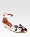 Mirrored metallic leather straps with a slight self-covered wedge and an adjustable ankle strap. Self-covered wedge, 1 (25mm)Metallic leather upperLeather lining and solePadded insoleImportedOUR FIT MODEL RECOMMENDS ordering true size. 