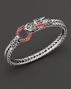 Eastern elements inform John Hardy's dragon head bracelet, featuring a polished silver link band and dragon head clasp with red sapphire.