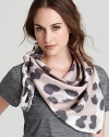 Channel your animal instincts in this SONIA RYKIEL beige scarf, printed with subdued gray spots.