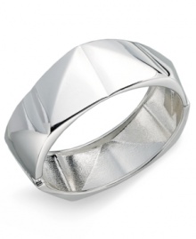 Sweet, slip-on style. Touch of Silver introduces affordable design with a structurally-unique bangle bracelet crafted in silver-plated steel. Approximate diameter: 2-1/2 inches. Approximate width: 4/5 inch to 1 inch.