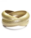 Twice as nice. Throw on Jones New York's curved and textured bangles and instantly pull together your look. Crafted from gold-plated mixed metal. Approximate diameter: 2-3/4 inches.