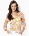 A vibrantly hued floral shirt is crafted from soft cotton sateen and finished with three-quarter sleeves and chic fold-back cuffs for a bold, tailored look, from Lauren by Ralph Lauren.