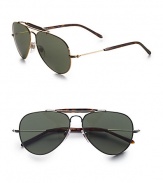 A timeless aviator style in lightweight metal, crafted with a traditional double bridge detail. Available in gold frames with green lenses or silver frames with silver mirror lenses. UV400 lens Made in Italy 