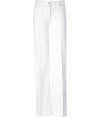 Stylish pants in white cotton - absolute trendy cut in  70s jet-set look - for women whose fashion models are Jerry Hall, Jackie O and Faye Dunaway - looks ladylike, elegant and grown-up - with wide, creased legs, a high waistband with belt loops, button fastener, front pockets - in  summery  white, which is now combined with white for a complete tone-on-tone look - with high wedge heels