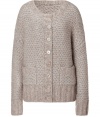 Luxurious cardigan in a cashmere-mohair blend - Tremendously soft and gentle on the skin - In elegant silver-beige-grey - Fashionable chunky knit, looks casual, yet classy at the same time - The cut is slim and comfortably long, with a round neck, long, dropped sleeves and wide ribbed cuffs - Full-length button placket, two pockets - A favorite basic to have, suitable for leisure and work - Pair with a pencil skirt, jeans, skinny corduroys