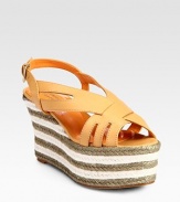 Crisscrossing leather straps encase the foot in a striped espadrille wedge design. Hemp wedge, 4 (100mm)Hemp platform, 3 (75mm)Compares to a 1 heel (25mm)Leather upperLeather lining and solePadded insoleMade in Spain