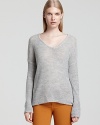 Express modern cool with this Helmut Lang sweater, flaunting twisted seams and a high/low hem for luxe layering.