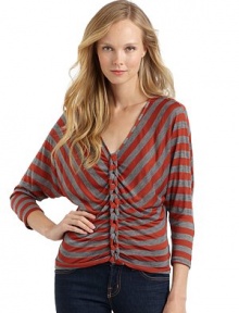 THE LOOKAllover stripesV-neckLong dolman sleevesChain link details down the centerPullover styleTHE FITAbout 22 from shoulder to hemTHE MATERIALRayon/polyesterCARE & ORIGINDry cleanMade in USAModel shown is 5'8 (172½cm) wearing US size Small. 