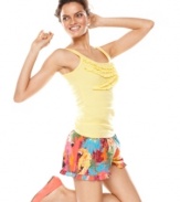 Have a sunny and fun day in Jenni's yellow tank and boxers set. The yellow tank features a pretty ruffle detail in the front while the comfy shorts feature a bright tropical print and an elastic waistband with drawstring.