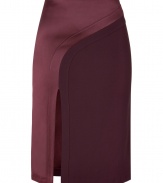 This striking mixed media pencil skirt from fashion-forward London brand Hakaan features a sumptuous satin panel and a flattering figure-hugging silhouette - High waist, satin asymmetric panel, curved seam, front slit, pencil silhouette, concealed back zip closure - Pair with an edgy silk blouse and sky-high platforms