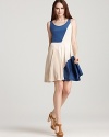 Master lady-like chic in this DKNY dress that flaunts a playful flared skit. Go ahead, give it a twirl.