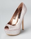 Covered in dazzling rhinestones, these shimmering STEVEN BY STEVE MADDEN pumps offer sparkling, standout style.