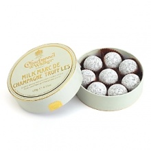 Lightly dusted truffles with a milk chocolate butter and Marc de Champagne center.