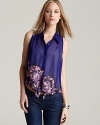 This sheer GUESS top is emboldened by an exuberant floral print and finished with a casually chic tie at the hem.