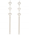 Follow your heart. A shimmering trio of crystal hearts sets apart these long, linear drop earrings from Betsey Johnson. Set in silver tone mixed metal with a chic multi chain silhouette, they'll add just the right amount of glitz and glamour to your going-out wardrobe. Approximate drop: 4-3/4 inches.