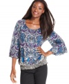 Style&co.'s petite peasant top is perfected with a vibrant print and pretty sleeves with ruffled cuffs.