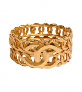 Ultra-luxe golden 1996 double C row bangle - This statement-making bracelet is authentic vintage Chanel from 1996 - Stylish gold-plated bracelet with two rows of interlocking circles and the iconic double C Chanel logo affixed on front - Amp up any outfit with this ultra-chic accessory - Perfect for cocktail attire or to dress up daywear