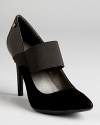 Calvin Klein reinterprets a classic pump, mixing smooth leather with soft suede.