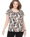 Look fashionable for a steal with Style&co.'s short sleeve plus size top, accented by a basketweave pattern and bold print-- it's an Everyday Value!