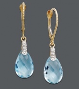 Add perfect pools of blue to your ensemble. Earrings feature pear-cut blue topaz (7 ct. t.w.) with a light dusting of diamond accents. Set in 14k gold. Approximate drop: 1-1/4 inches.