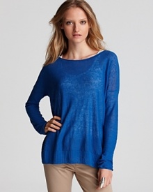 In an ocean blue hue, this sheer Vince sweater is a tranquil option for your getaway collection. Pair it with neutral hues for a pop of personality.