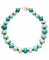 Turquoise temptation. Who can resist the summery style of graduated turquoise beads? Lauren by Ralph Lauren's Island Getaway necklace features reconstituted turquoise in a gorgeous green/blue palette. Made in gold tone mixed metal, it includes a toggle closure. Approximate length: 18 inches.