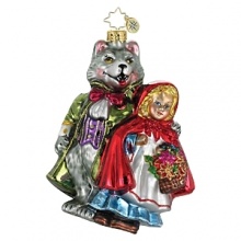 The bespoke wolf is clothed in a green jacket and red bow tie, matching Red Riding Hood's cape.