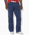 A relaxed-fitting pant in lightweight cotton poplin exudes rugged regality with a button-flap cargo pocket at the leg.