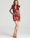 Black Halo goes floral with the ruffle-sleeved Eva mini dress, romantic in a rosy print.