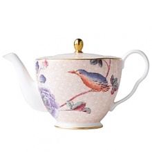 Step into a delightful garden party with Wedgwood's whimsical Cuckoo collection. Inspired by nature, this richly accented teapot adds a flourish of color to your table with sophisticated and lively style.