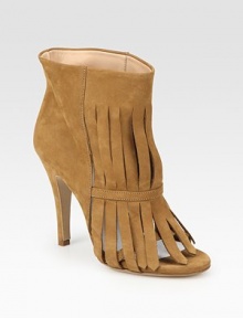 Trendy fringe and a peep toe complement this ankle-grazing suede style. Self-covered heel, 4 (100mm)Suede upperPull-on styleLeather lining and solePadded insoleMade in ItalyOUR FIT MODEL RECOMMENDS ordering one half size up as this style runs small. 