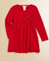 A cozy, cute knit frock with a velveteen bow and front pockets for utility and style.Round necklineLong sleevesPullover styleHigh-waisted with velveteen bowPatch pockets95% viscose/5% spandexHand washImported