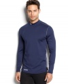 Under Armour® mock neck shirt is designed with Evo Coldgear® fabric that wicks moisture from the skin and circulates body heat keeping athletes warm, without weighing them down.