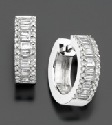 Sophisticated and versatile, exquisite round and baguette-cut diamond (3/4 ct. t.w.) hoop earrings deliver pure sparkle and style. Diamond earrings set in 14k white gold. Diameter measures approximately 1/2 inch.