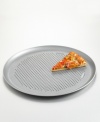 No need for takeout-this Calphalon® pizza pan serves up fresh homemade pie from the comfort of your kitchen. Features include nonstick interiors and exteriors for easy cleaning, no-hassle food release and optimum baking performance. Reinforced nonstick surface also offers long-lasting durability. Constructed of aluminized steel to resist rusting. Rolled edges are reinforced with tinned steel wire for added strength. Vent holes at bottom of pan allow for a crispy crust. Oven safe to 450 degrees. Lifetime warranty. Model BW6016.