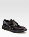 Leather wing-tip style with rubber sole and colored micro detail.Leather upperLeather liningRubber soleMade in Italy