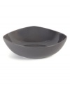 Inspired by an iconic Nambe design, this sculptural serving bowl features three gentle points in sleek, sturdy stoneware with a smoke-colored glaze. An essential part of the Tri-Corner dinnerware collection.