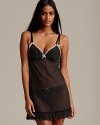 Pinstripes and a ruffled trim lend flirty style to this babydoll from Cosabella.