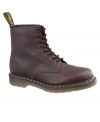 This pair of men's boots is pure Dr. Martens--funky modern boots for men crafted in quality leather, with their signature yellow topstitching and logo tag at heel. Imported.