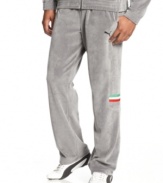 Take the lead and stay ahead of the pack with comfort and style in these velour Ferrari track pants from Puma.