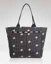 LeSportsac's signature nylon tote keeps essentials tied up with flirty white bows--let it carry you from workdays to weekends with feminine attitude.