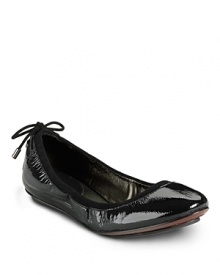 A sleek silhouette and feminine lace-up detail make these your must-have flats. From Cole Haan.