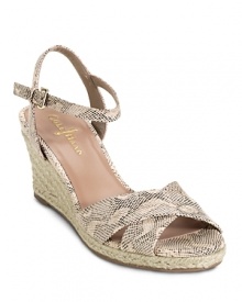 A warm weather wedge sandal with a jute wrapped heel and braided jute detail in contrasting colors. From Cole Haan.