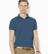 An iconic short-sleeved polo shirt is cut in a relaxed, comfortable fit from breathable cotton mesh for classic style.