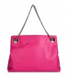 Glamorize every look with Valentinos bright pink leather shoulder bag, detailed with oversized rockstuds and a chain-link strap for that impossibly ladylike feel - Embossed logo, removable chain shoulder strap with oversized rockstuds at base, two inside sections, zippered middle sectional pocket, zippered back wall pocket, two front wall slot pockets, protective feet - Carry as a pretty polish to day and evening looks alike